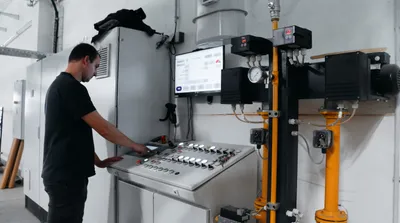 Operator controlling the lamination line from the control panel
